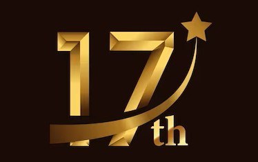 a gold number seventeen with a star on top of it